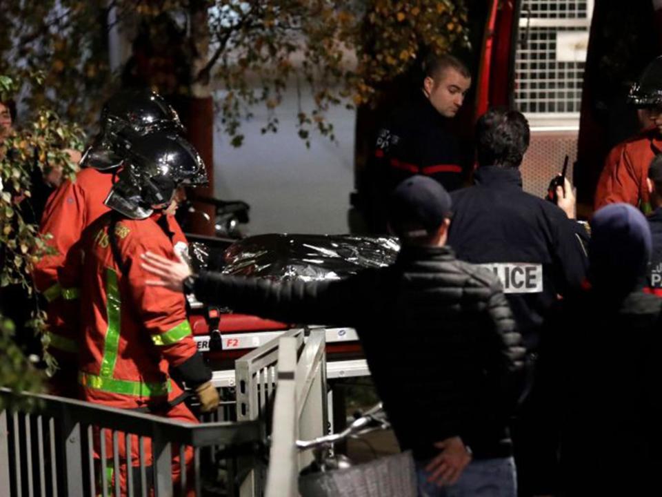 Police officials and rescue personnel transport the body of a tiger which had escaped from a circus into a vehicle: AFP