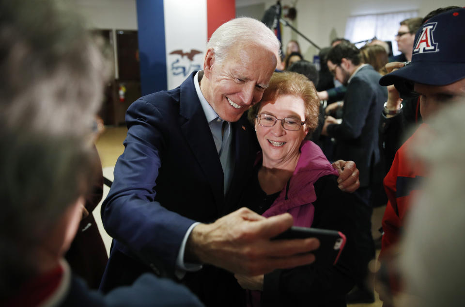 Democratic presidential candidate former Vice President Joe Biden takes a selfie during a campaign event on foreign policy at a VFW post Wednesday, Jan. 22, 2020, in Osage, Iowa. (AP Photo/John Locher)