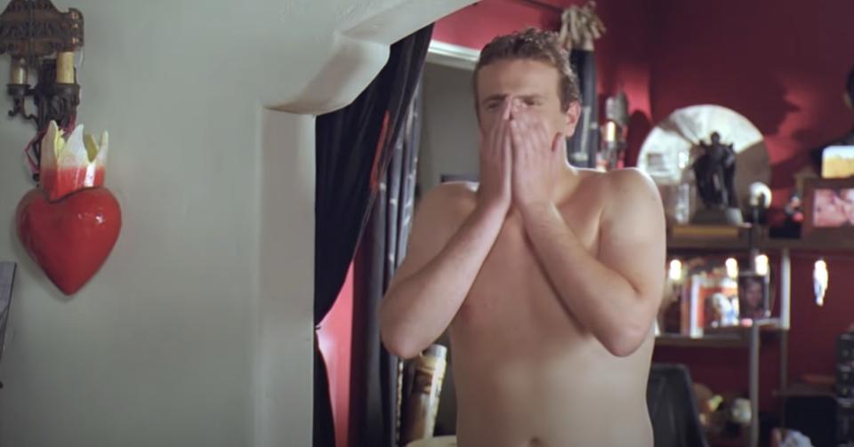 Jason Segal shirtless with his hands covering his face in shock during the opening scene of "Forgetting Sarah Marshall"