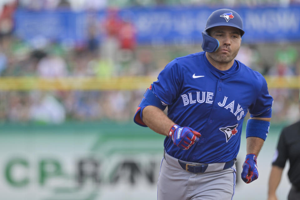 Toronto Blue Jays' Joey Votto circles the bases after hitting a solo home run off Philadelphia Phillies starter Zack Wheeler during the first inning of a spring training baseball game Sunday, March 17, 2024, in Clearwater, Fla. (Steve Nesius/The Canadian Press via AP)