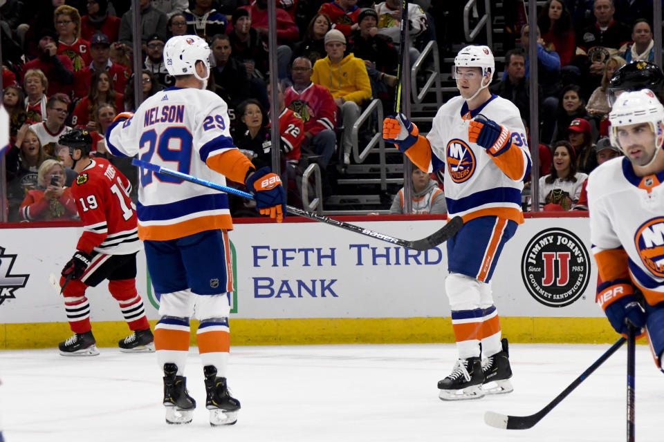 New York Islanders left wing Ross Johnston (32) celebrates with center Brock Nelson (29) after Johnston scored against the Chicago Blackhawks during the first period of an NHL hockey game Friday, Dec. 27, 2019, in Chicago. (AP Photo/Matt Marton)