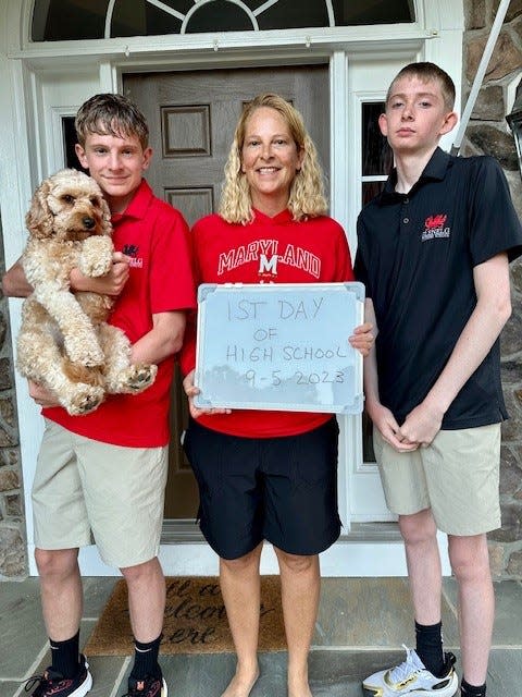 Brenda Frese and her boys, Tyler (on left holding Archie) and Markus.