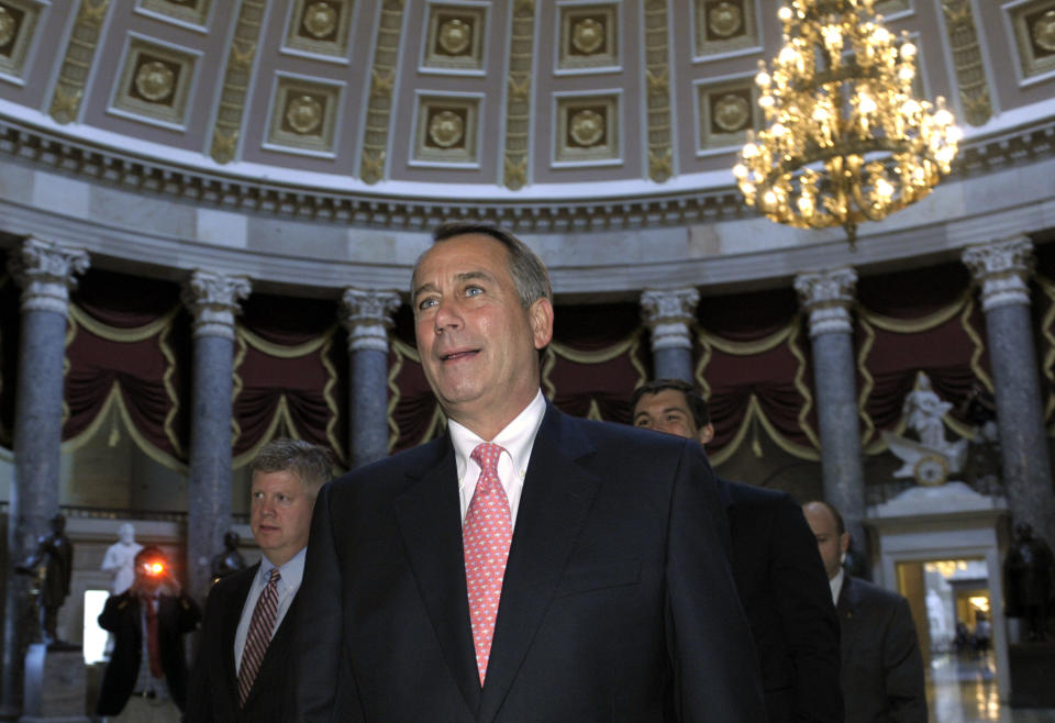 FILE - House Speaker John Boehner of Ohio walks to the floor to vote on a plan to raise the debt ceiling on Capitol Hill in Washington, Aug. 1, 2011. Lessons learned from the debt ceiling standoff more than a decade ago are rippling through Washington. Back in 2011 the debate around raising the debt ceiling was eerily familiar. Newly elected House Republicans were eager to confront the Democratic president and force spending cuts. (AP Photo/Susan Walsh, File)