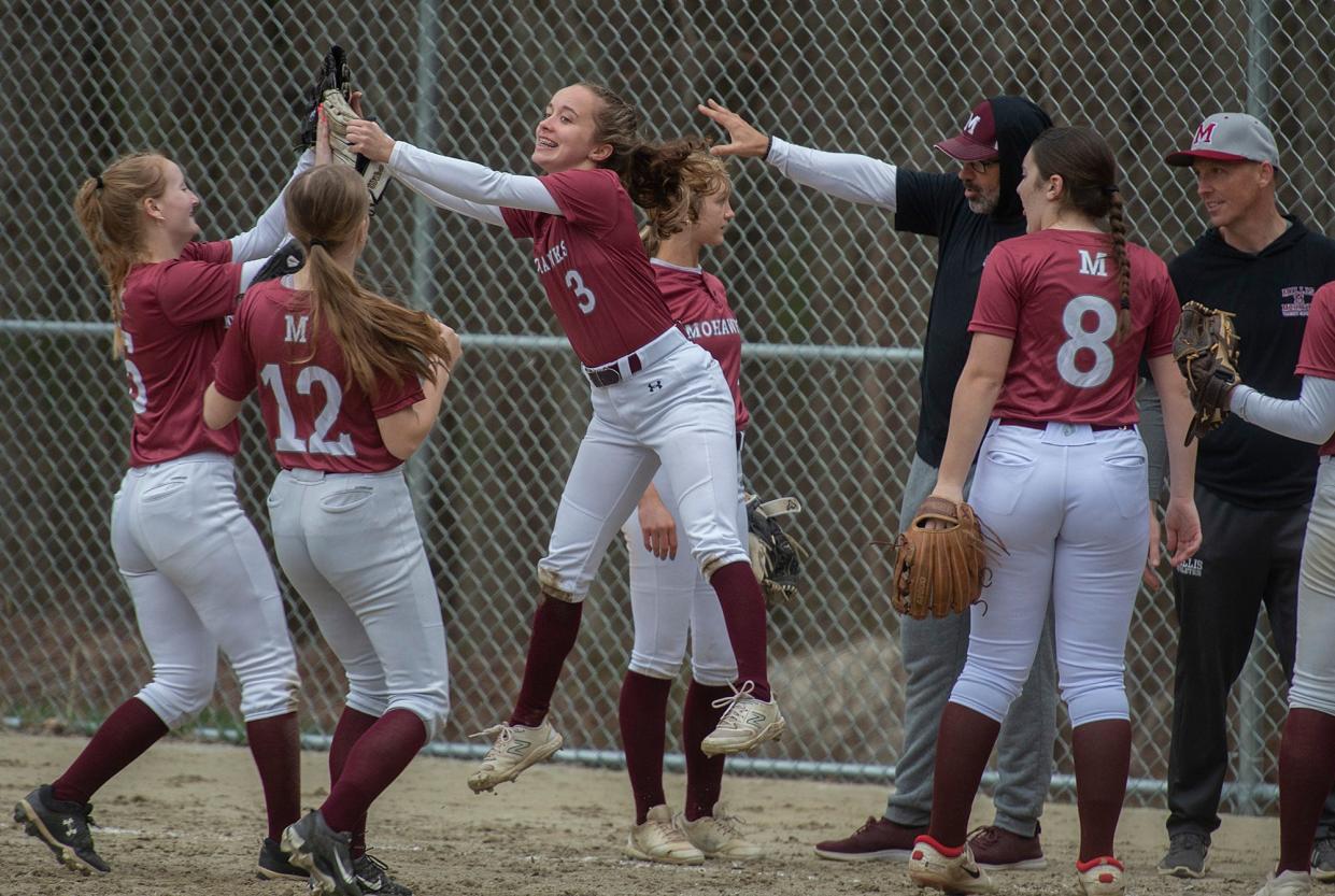 Millis High School second baseman Zoe Sparks leaps in the air after making an out to end the sixth inning in a 7-0 win at Bellingham, April 10, 2024.