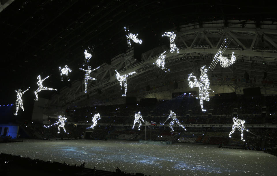 Illuminated figures are suspended during the opening ceremony of the 2014 Winter Olympics in Sochi, Russia, Friday, Feb. 7, 2014. (AP Photo/Mark Baker)