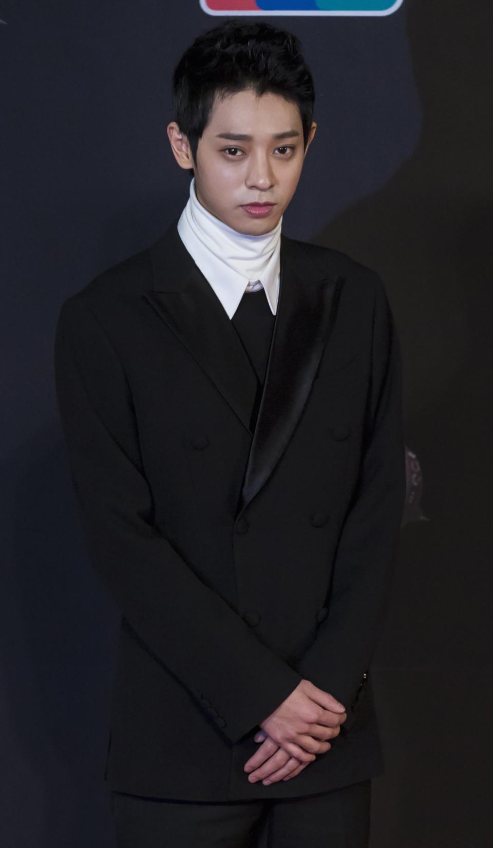 South Korean singer Jung Joon-young poses on the red carpet as he attends the 2014 Mnet Asian Music Awards (MAMA) in Hong Kong
