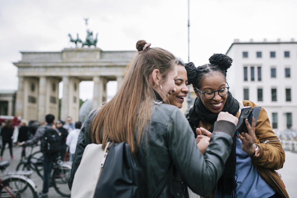 friends smiling at a phone