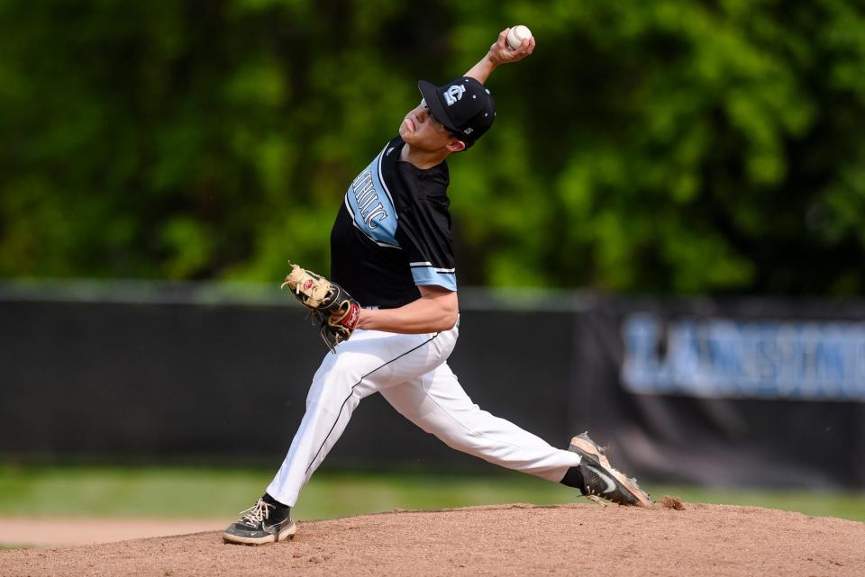 Lansing Catholic's Drew Diehl pitches to an Olivet batter during the first inning on Tuesday, May 23, 2023, at Kircher Municipal Park in Lansing.