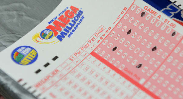 Mega Millions lottery ticket forms at a