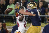 Southern California safety Xavion Alford (29) breaks up a pass intended for Notre Dame tight end Michael Mayer (87) in the first half of an NCAA college football game in South Bend, Ind., Saturday, Oct. 23, 2021. (AP Photo/Paul Sancya)