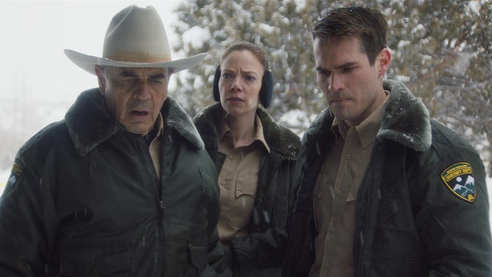 Sheriff Hadley (Robert Forster, left) investigates a vicious murder with fellow officers Julia (Riki Lindhome) and his son John (Jim Cummings) in "The Wolf of Snow Hollow."