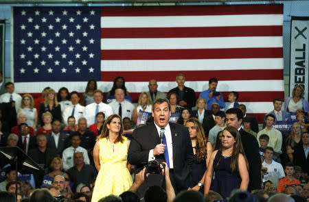 Chris Christie stands with family members as he announces his campaign for the 2016 Republican presidential nomination during a kickoff rally at Livingston High School in Livingston, New Jersey, June 30, 2015. REUTERS/Brendan McDermid