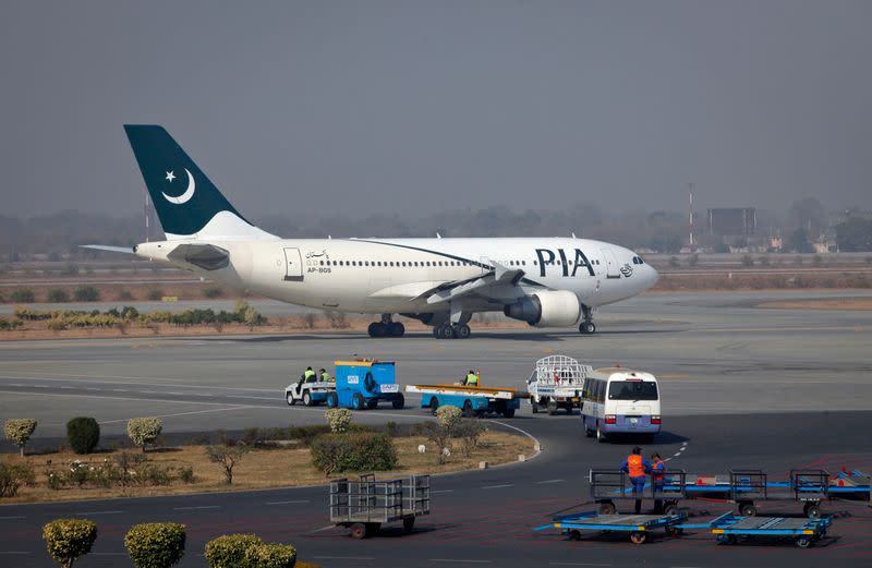 A Pakistan International Airlines (PIA) plane prepares to take-off at Alama Iqbal International Airport in Lahore