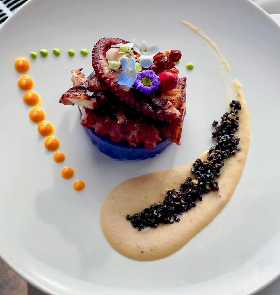 Grilled octopus with purple mashed-potato-bean puree and lentils at Acquario Italian.