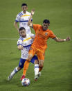 San Jose Earthquakes midfielder Eduardo Lopez (9) fouls Houston Dynamo FC midfielder Joe Corona (14) during the first half of an MLS soccer game at BBVA Stadium on Friday, April 16, 2021, in Houston. (Godofredo A. Vásquez/Houston Chronicle via AP)