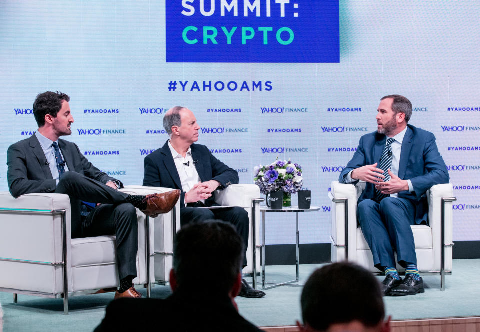 L-R: Yahoo Finance’s Daniel Roberts and Andy Serwer interview Brad Garlinghouse, CEO of Ripple, at the Yahoo Finance All Markets Summit: Crypto on Feb. 7, 2018. (Gino DePinto/Oath)