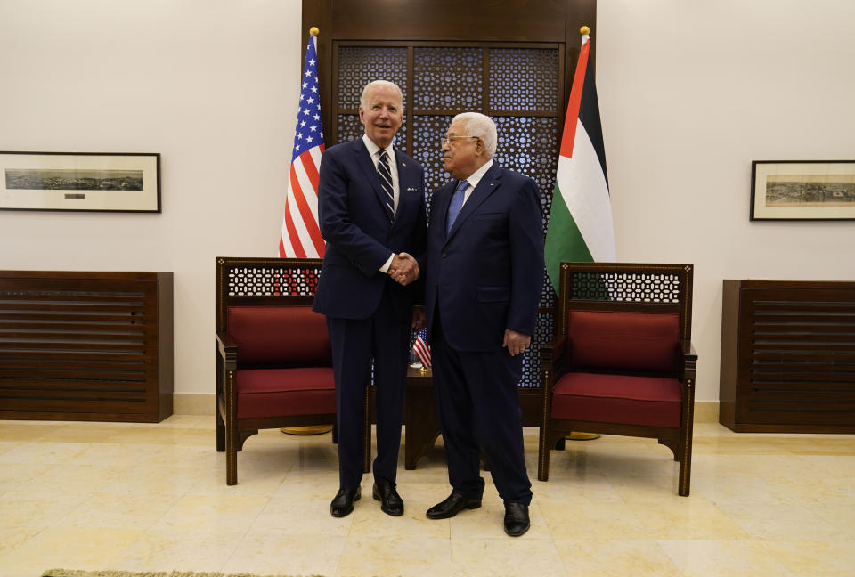 Palestinian President Mahmoud Abbas and U.S. President Joe Biden shake hands in the West Bank town of Bethlehem, Friday, July 15, 2022. (AP Photo/Evan Vucci)