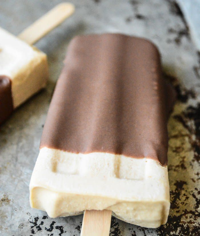 <strong>Get the <a href="http://theviewfromgreatisland.com/chocolate-dipped-peanut-butter-ice-cream-bars/" target="_blank">Chocolate-Dipped Peanut Butter Popsicles recipe</a>&nbsp;from&nbsp;The View from Great Island</strong>