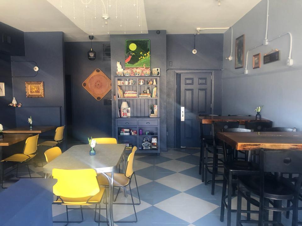 Hot Dish Pantry renovated the interior with blue walls and retro decor, paying homage to the Boy Blue ice cream stand that had once occupied part of the space