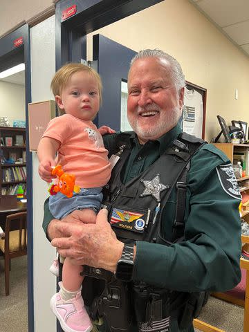 <p>LCSO</p> Deputy William Weaver with baby Cheyanne.