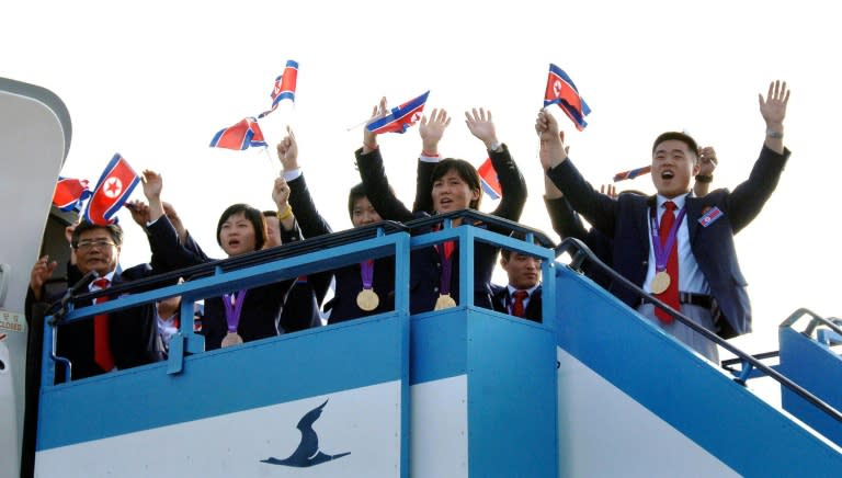 A handout from North Korea's official Korean Central News Agency (KCNA) shows North Korean athletes from the 2012 London Olympic Games as they returned to Pyongyang