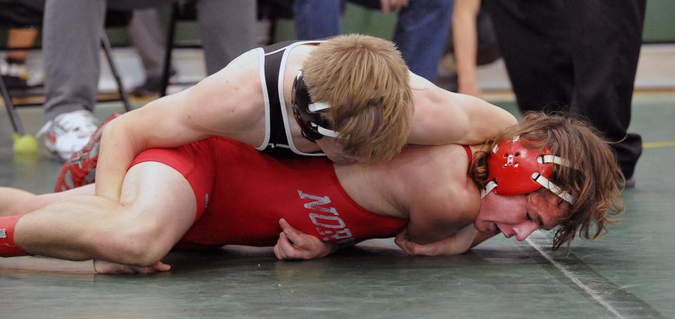 Norwayne's Gibson Moore is defeated 8-5 by Tusky Valley's T. J. Wilson in the 132-pound final.