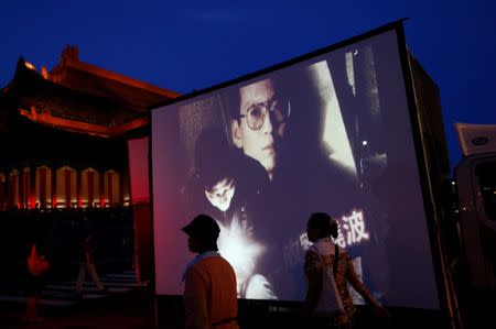 A screen showing images of late Nobel Peace Prize laureate Liu Xiaobo is seen during a ceremony to mourn him, in Taipei, Taiwan July 14, 2017. REUTERS/Tyrone Siu