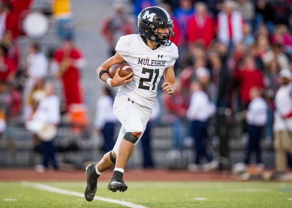 Muleshoe’s Daniel Sianez (21) runs the ball against Jim Ned during the UIL 3A-D1 Area Playoff game on Friday, Nov. 19, 2021, at PlainsCapital Park-Lowrey Field in Lubbock, Texas.