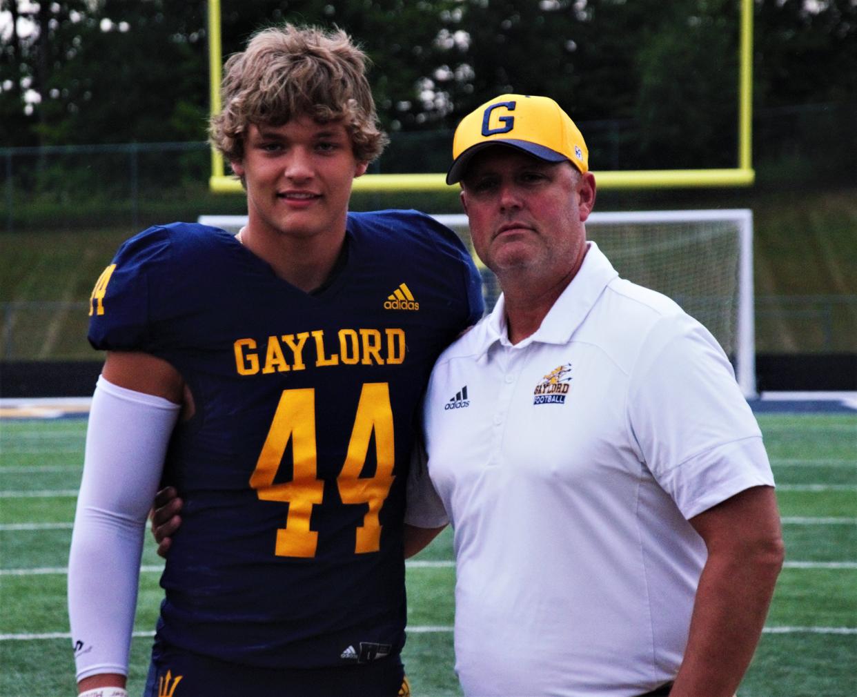 Son Brady Pretzlaff (left) and father Jeff Pretzlaff (right) have shared a bond over their love for football for a long time. Now, Jeff will watch Brady continue his career at the University of Minnesota.