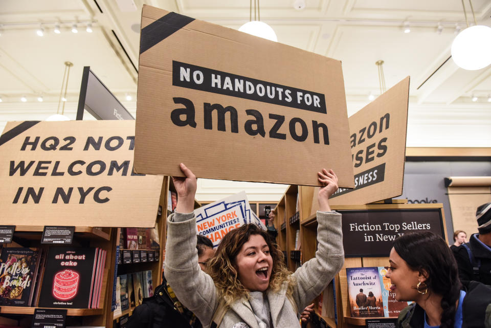 NEW YORK, NY - NOVEMBER 26: People opposed to Amazon's plan to locate a headquarters in New York City hold a protest inside of an Amazon book store on 34th. St. on November 26, 2018 in New York City. Amazon recently announced that New York City will become one of two locations that will house Amazon's second North American headquarters, known as HQ2. (Photo by Stephanie Keith/Getty Images)