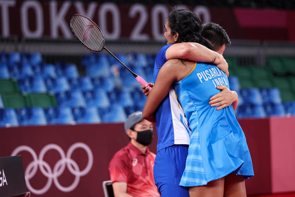 CHOFU, JAPAN - AUGUST 01: Pusarla V. Sindhu of Team India celebrates with her coach Park Tae-sang(left) as she wins against He Bing Jiao of Team China during the Women’s Singles Bronze Medal match on day nine of the Tokyo 2020 Olympic Games at Musashino Forest Sport Plaza on August 01, 2021 in Chofu, Tokyo, Japan. (Photo by Lintao Zhang/Getty Images)