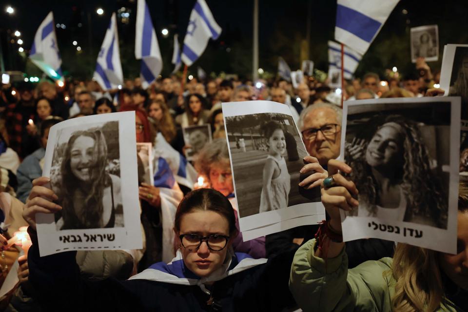 People display images of victims of Hamas' deadly attack during a demonstration in support of Israel on Oct. 11 in Santiago, Chile.