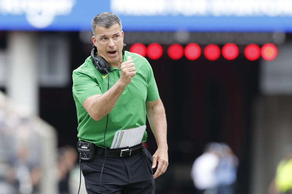 Oregon head coach Mario Cristobal instructs his players during the first half of an NCAA college football game against Ohio State, Saturday, Sept. 11, 2021, in Columbus, Ohio. (AP Photo/Jay LaPrete)