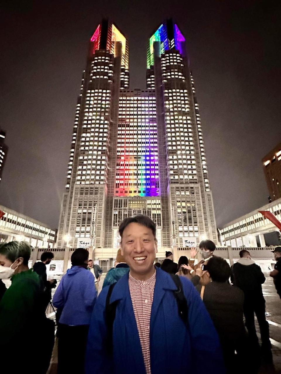 Shinya Yamagata poses for a photo in front of Tokyo's city hall building on November 1, 2022, as the city began issuing partnership certificates to same-sex couples - which he sees as a 