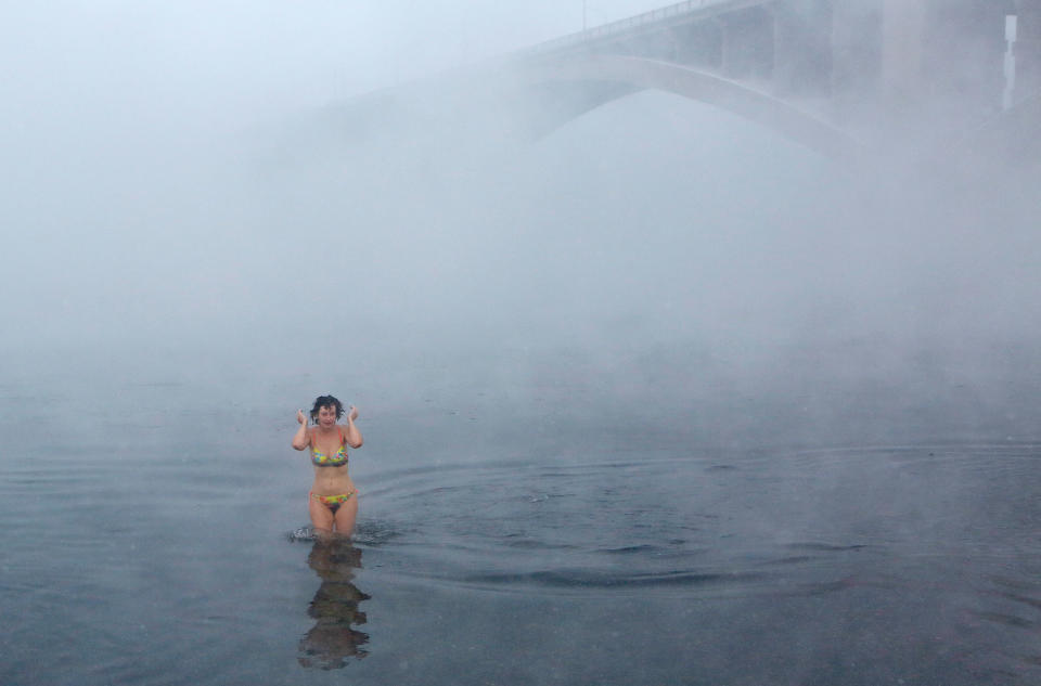 A swimmer braces against the cold in Krasnoyarsk, Russia