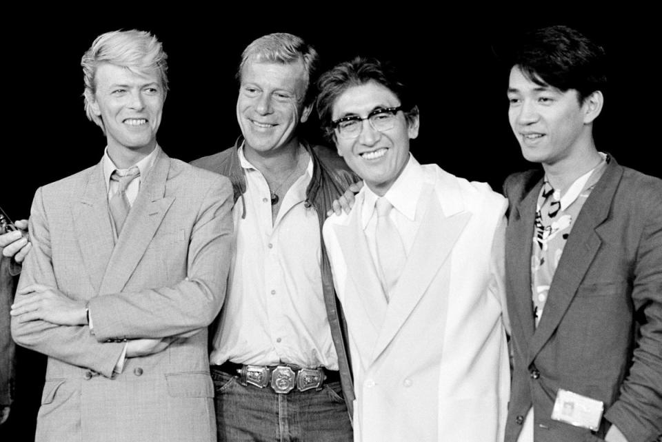 Ryuichi Sakamoto (right), pictured with (L-R) Merry Christmas, Mr Lawrence star David Bowie; producer Jack Thomas, producer; and director Nagisa Oshima (AP)