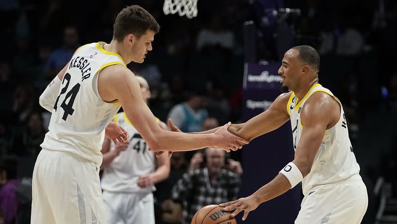 Utah Jazz guard Talen Horton-Tucker, right, and center Walker Kessler celebrate their win against the Charlotte Hornets in an NBA basketball game on Saturday, March 11, 2023, in Charlotte, N.C.