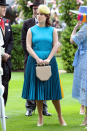 Eugenie wore a sleeveless look by Calvin Klein paired with a contrasting yellow hat. Photo: Getty