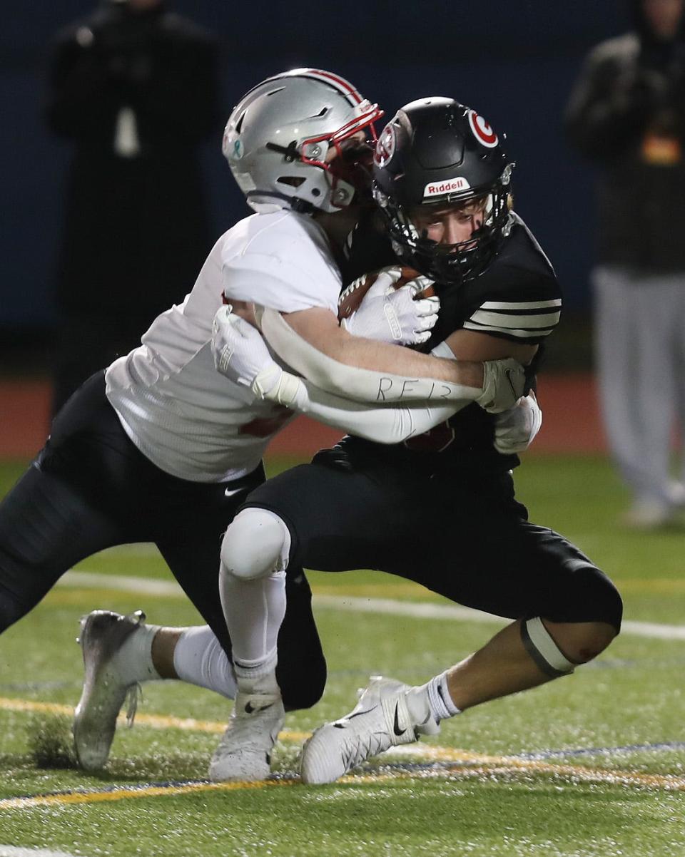 Somers' Ethan Krauss (5) sacks Rye quarterback Teddy Berkery (10) during the Class A state semifinal at Middletown High School Nov. 26, 2021. Somers won the game 14-7.