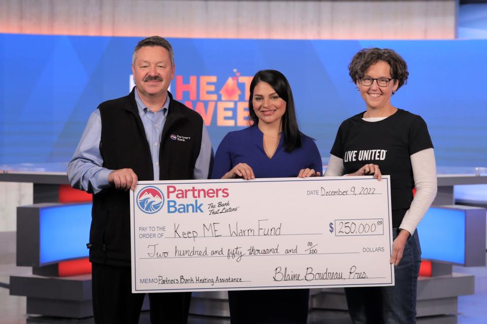 From left to right Partners Bank President and CEO, Blaine Boudreau and WMTW Anchor, Meghan Torjussen, present a check to United Way of Southern Maine SVP, Technology and Communications, Kristin Chase Duffy.