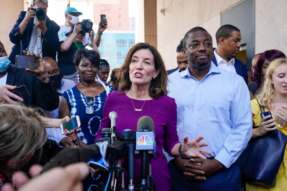 New York Gov. Kathy Hochul, center, joined by New York State Sen. Brian Benjamin , right, speaks to reporters after an event in the Harlem neighborhood of New York, Thursday, Aug. 26, 2021, in New York. Hochul selected Benjamin as her choice for lieutenant governor. (AP Photo/Mary Altaffer)