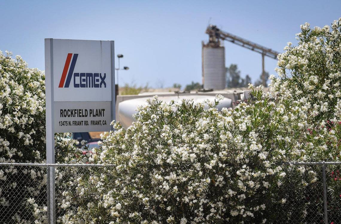 A sign for the CEMEX Rockfield aggregate plant site in Friant is visible from Friant Road on Wednesday, June 17, 2020. The company applied to Fresno County to continue mining the quarry for 100 years, and use blasting and drilling to mine a 600-ft deep pit. CRAIG KOHLRUSS/ckohlruss@fresnobee.com