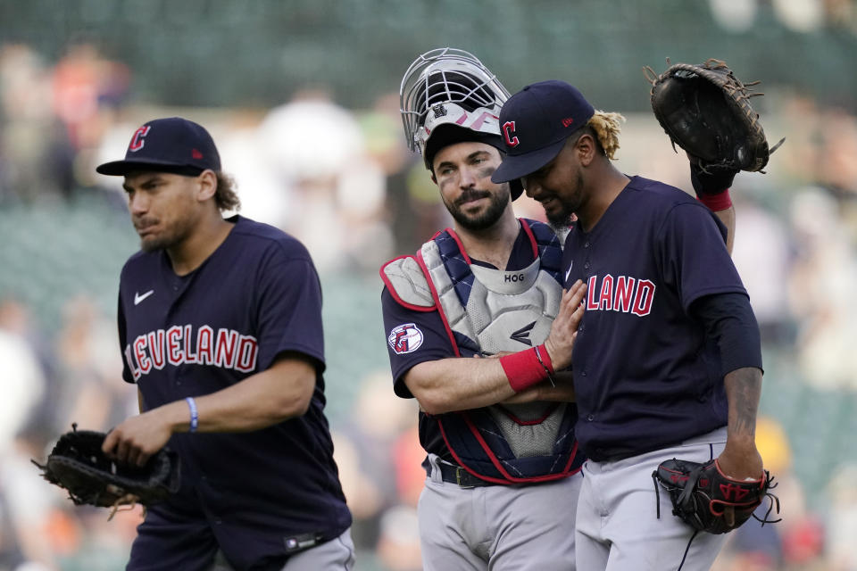 Cleveland Guardians catcher Austin Hedges hugs relief pitcher Emmanuel Clase after the ninth inning of a baseball game against the Detroit Tigers, Saturday, May 28, 2022, in Detroit. Cleveland defeated Detroit 8-1. (AP Photo/Carlos Osorio)