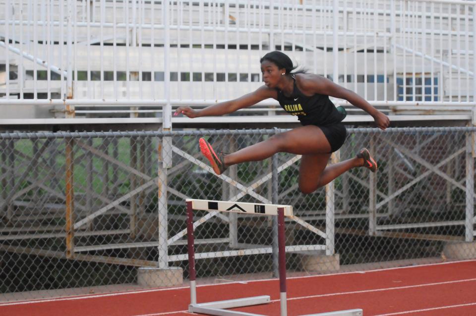 Salina South's Tamia Cheeks leaps over a hurdle during the 300-meter hurdles of the AVCTL-I Championships Friday, May 13, 2022, at Salina Stadium.