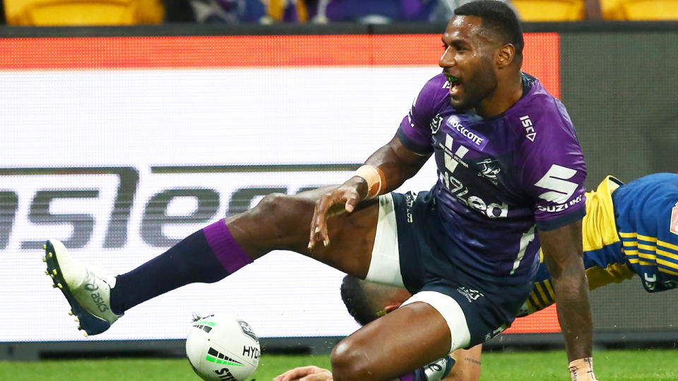 Ex-Melbourne Storm star Suliasi Vunivalu is pictured after scoring a try in the NRL.