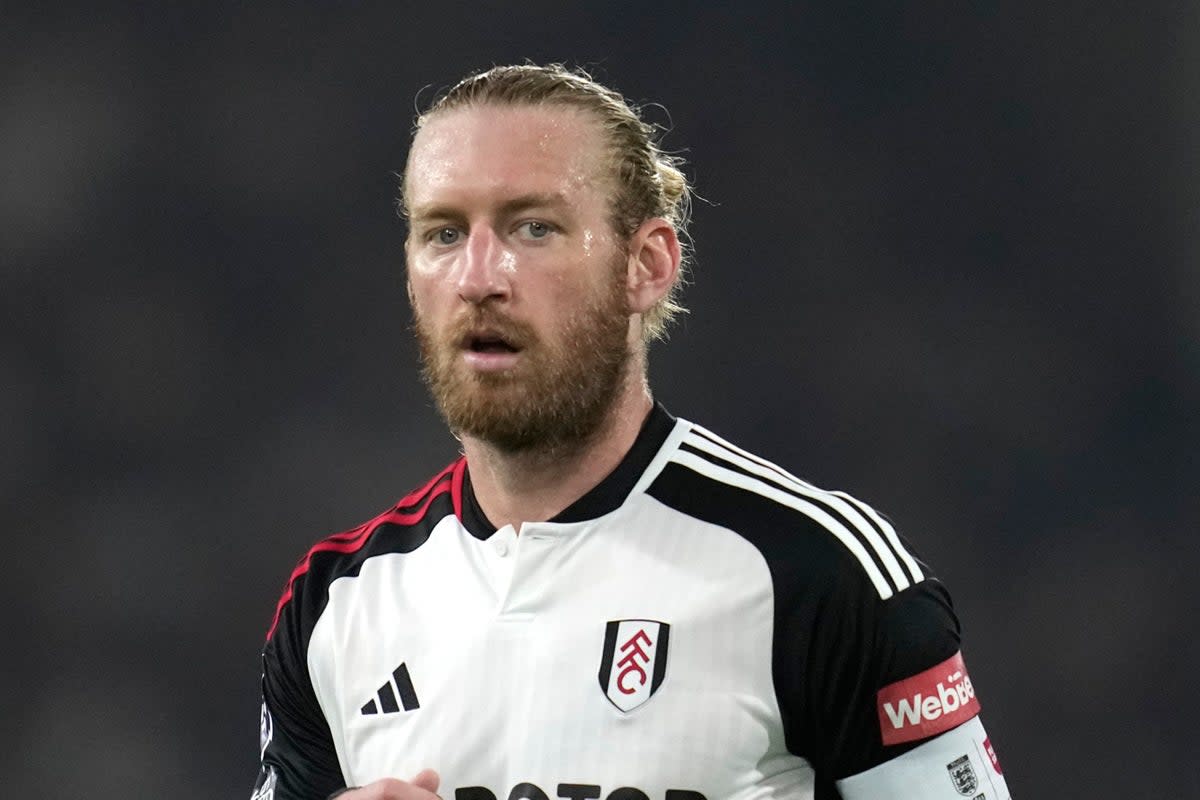 Night to forget: Tim Ream was caught out twice for Chelsea’s second goal against Fulham on Monday  (AP)