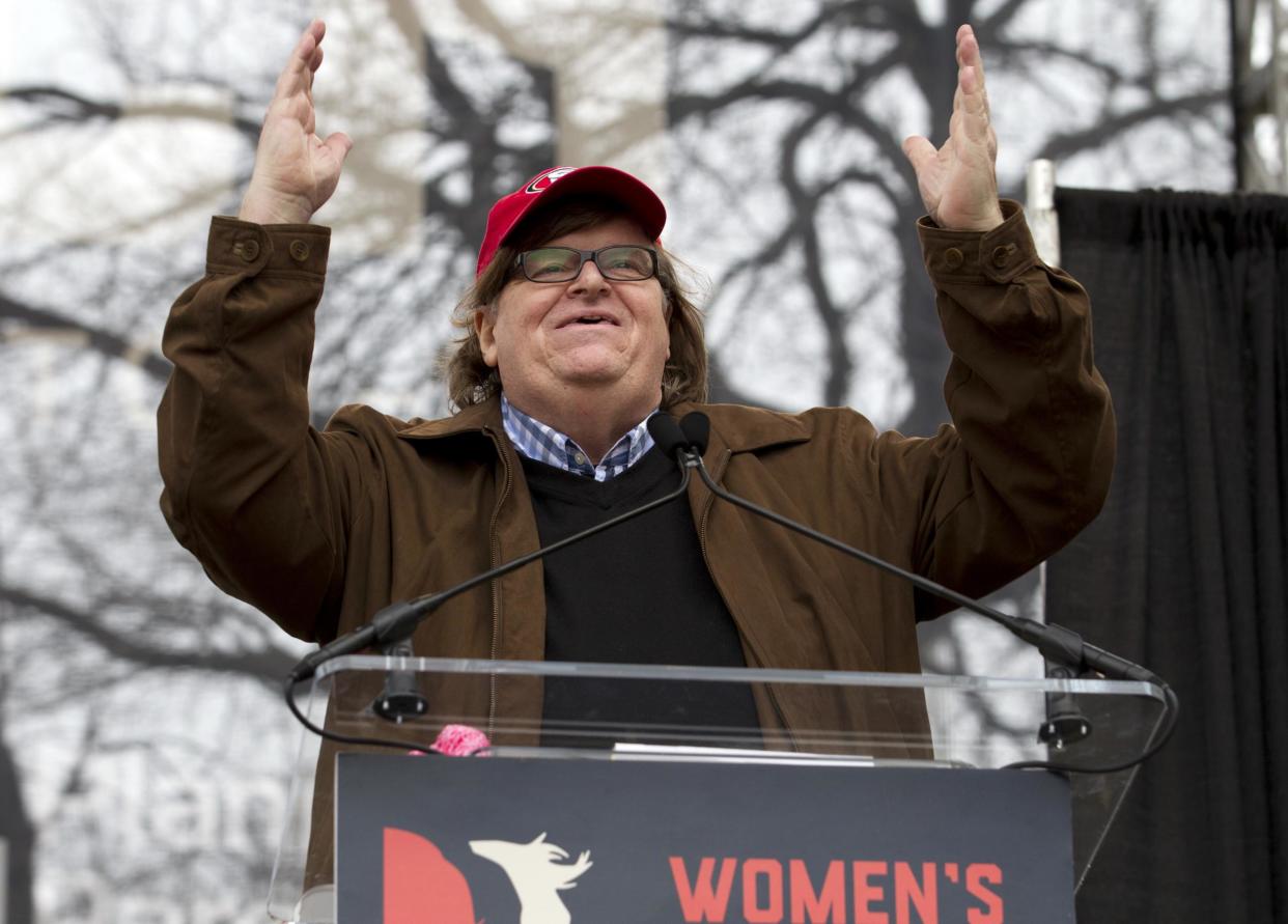 Film director Michael Moore speaks to the crowd during a women's march rally: AP