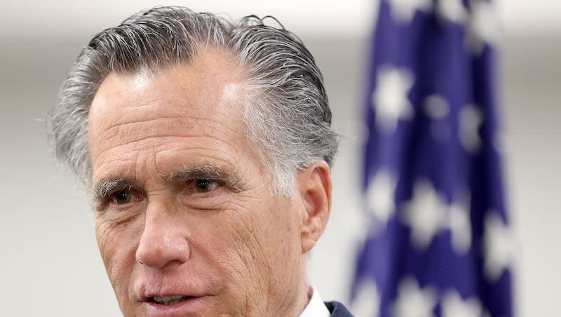 Sen. Mitt Romney, R-Utah, speaks to members of the media while visiting the State Department’s Salt Lake City Passport Fair at the Bennett Federal Building in Salt Lake City on Friday, Feb. 16, 2024.