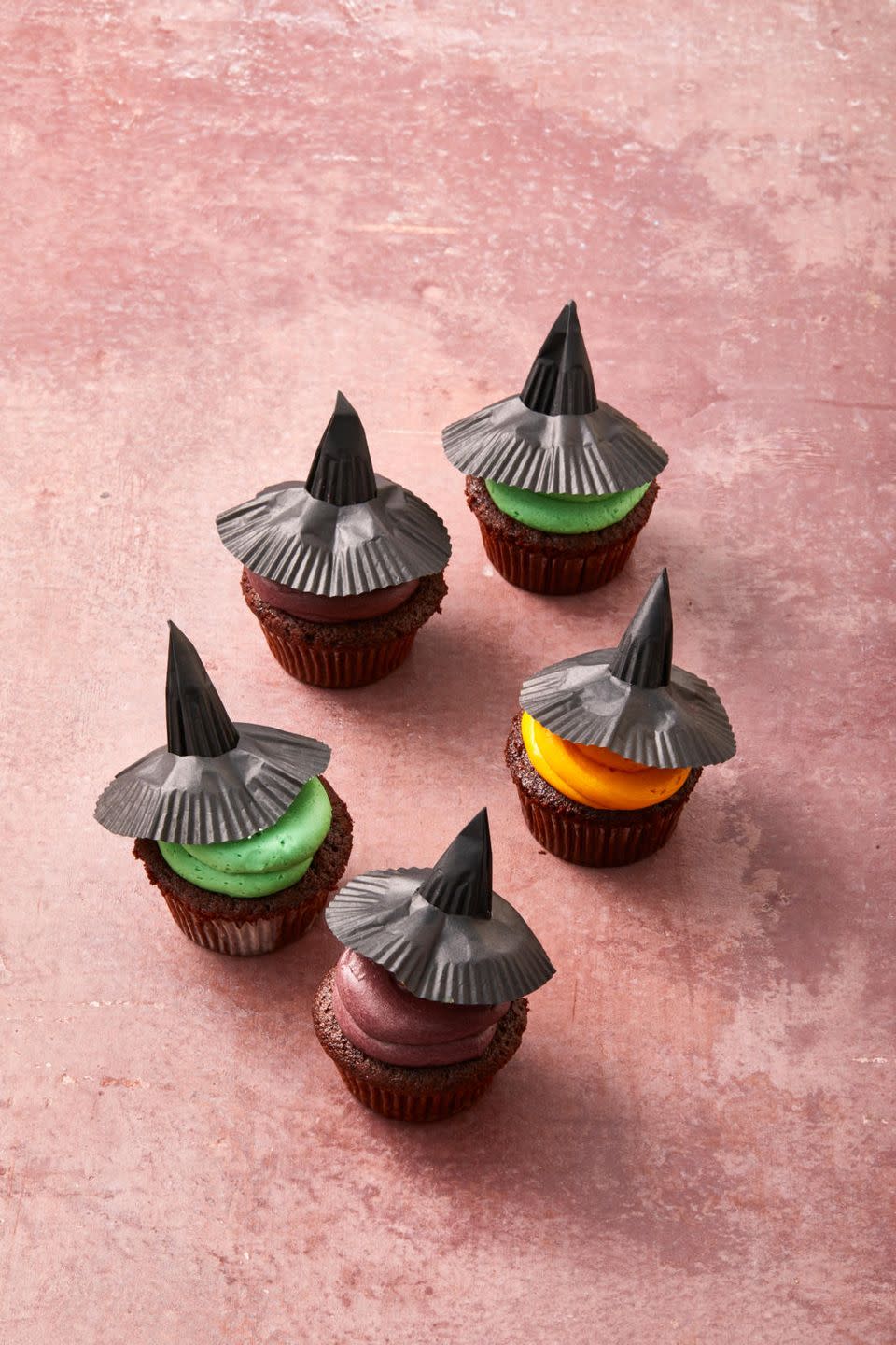 <p>Hats off to these witchy Halloween <a href="https://www.goodhousekeeping.com/food-recipes/a28566002/chocolate-cupcakes-recipe/" rel="nofollow noopener" target="_blank" data-ylk="slk:chocolate cupcakes;elm:context_link;itc:0;sec:content-canvas" class="link ">chocolate cupcakes</a> topped with buttercream frosting and crafty cupcake liners.</p><p>Get the <a href="https://www.goodhousekeeping.com/food-recipes/dessert/a33460086/witch-cupcakes-recipe/" rel="nofollow noopener" target="_blank" data-ylk="slk:Witch Cupcakes recipe;elm:context_link;itc:0;sec:content-canvas" class="link "><strong>Witch Cupcakes recipe</strong></a><em>.</em></p>