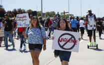 <p>Activists hold signs as they march onto Chicago Dan Ryan Expressway to protest violence in the city on July 7, 2018 in Chicago, Ill. (Photo: Kamil Krzaczynski/Getty Images) </p>